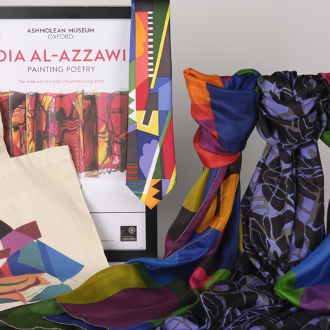 Range of shop products including scarves, a poster in a frame, and a tote bag.