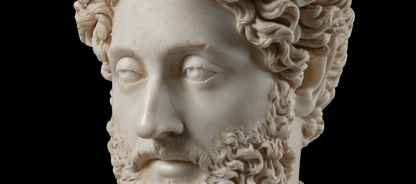 Close up detail of marble sculpture of a bearded man
