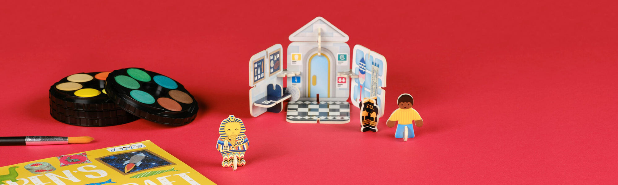 Ashmolean children's toys and kit set against red background