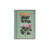 Green A5 journal with flowers artwork on cover in green pink and orange with detailed spine with gold accents on a white background.