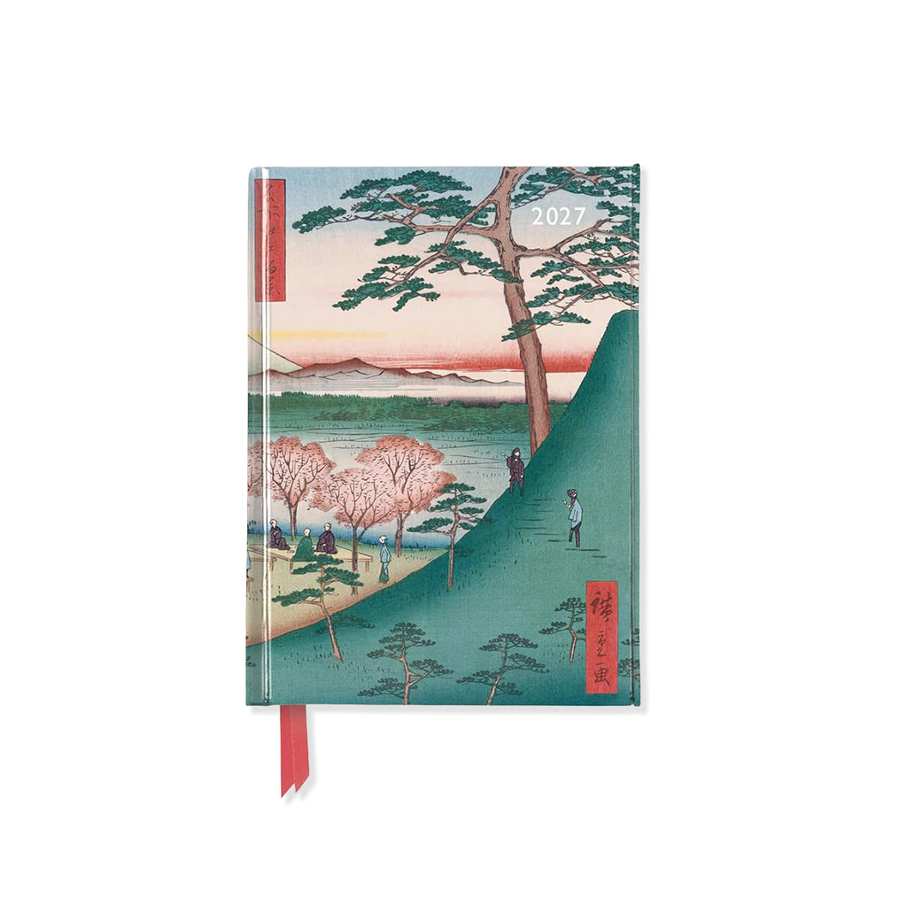 Notebook with a scenic Japanese design of Mount Fuji on the cover, featuring trees and people, on a white background.