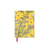 Notebook with floral and bird design on a yellow background