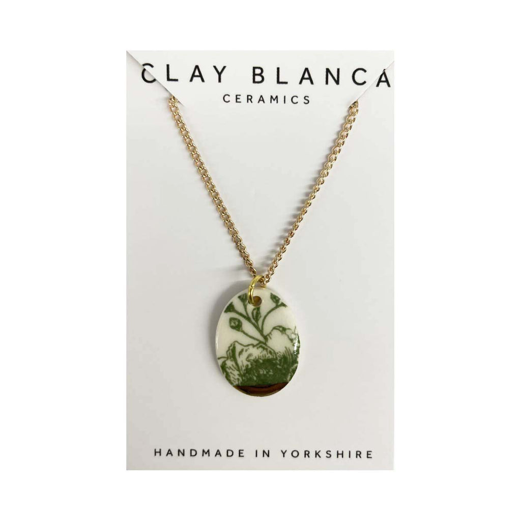 Necklace with a floral pendant on a Clay Blanca Ceramics card