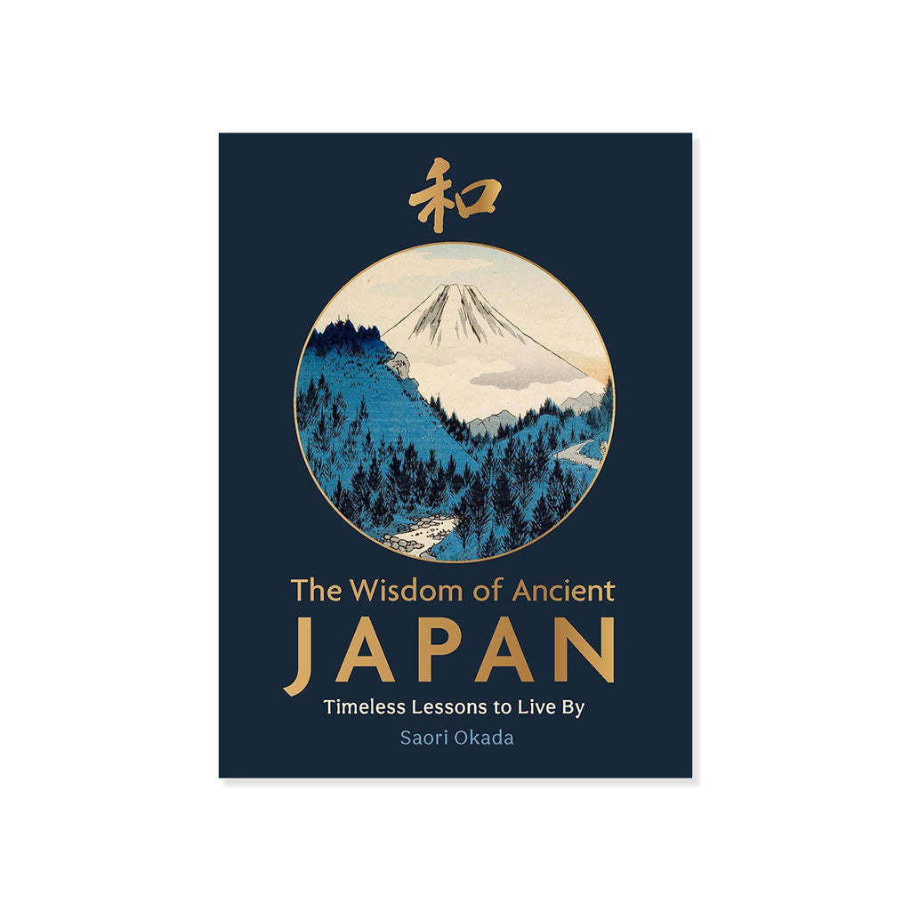 Book cover for 'The Wisdom of Ancient Japan' by Saori Okada, featuring a dark navy blue background with a central circular Japanese-style illustration of Mount Fuji, a forest, and a river, accented with gold text and a gold Japanese character at the top.