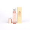 Roll on perfume bottle with decorative card box with 'ALASHIYA' text on a white background.