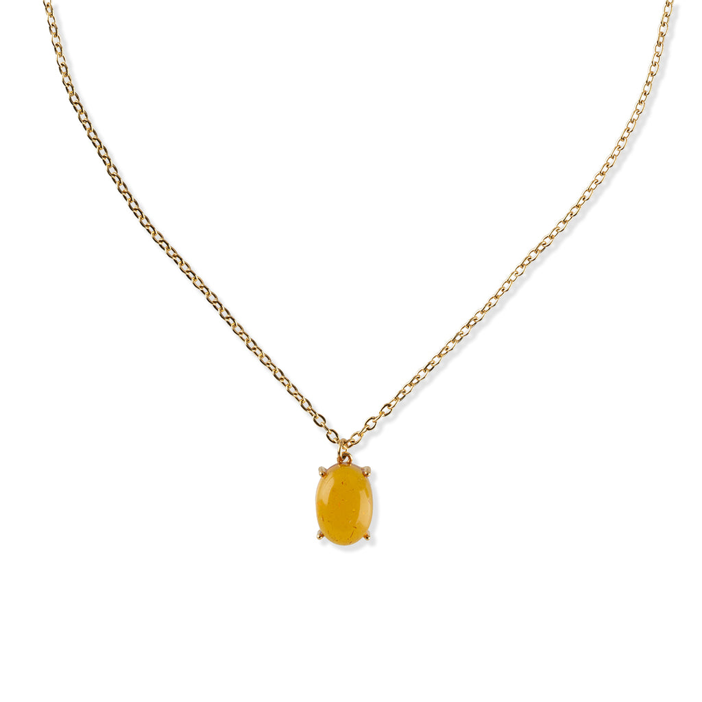 Gold necklace with a yellow gemstone pendant on a white background