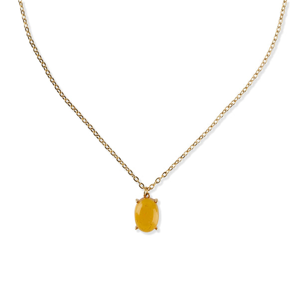 Gold necklace with a yellow gemstone pendant on a white background