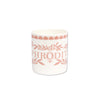 A white ceramic mug featuring a terracotta pink printed design with the word 'PHRODIT' and floral/leaf motifs, set against a plain white background.