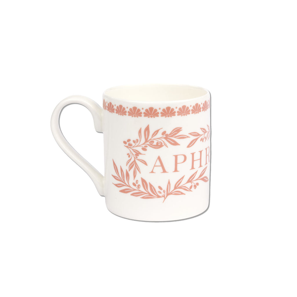 A white ceramic mug featuring a terracotta pink printed design with the word 'APHR' and floral/leaf motifs, set against a plain white background.