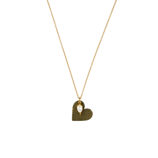 A gold chain necklace with a textured, hammered gold heart pendant featuring a small white teardrop gemstone in the center, shown against a plain white background.