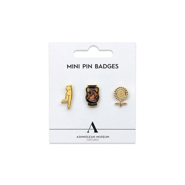 Set of 3 mini pin badges featuring one Greek pot, one nude torso sculpture and one Cypriot Ankh female symbol design against a white card background with black 'ASHMOLEAN MUSEUM OXFORD' text and 'A' logo. 