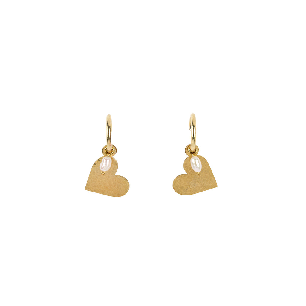 A pair of gold heart-shaped drop earrings with a small clear teardrop pearl hanging from each earring, shown against a plain white background.