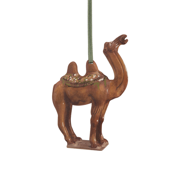 Camel-shaped wooden decoration against a white background