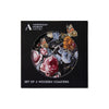 Black box holding 4 coasters with Dutch still life artwork designs of colourful flowers with Ashmolean Museum branding on a white background. 