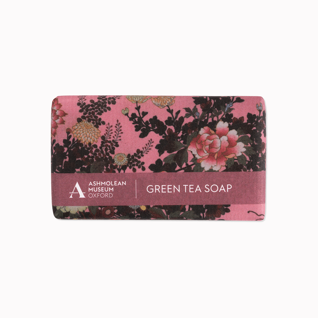 Bar of Green Tea soap with floral design and Ashmolean Museum branding on a pink background