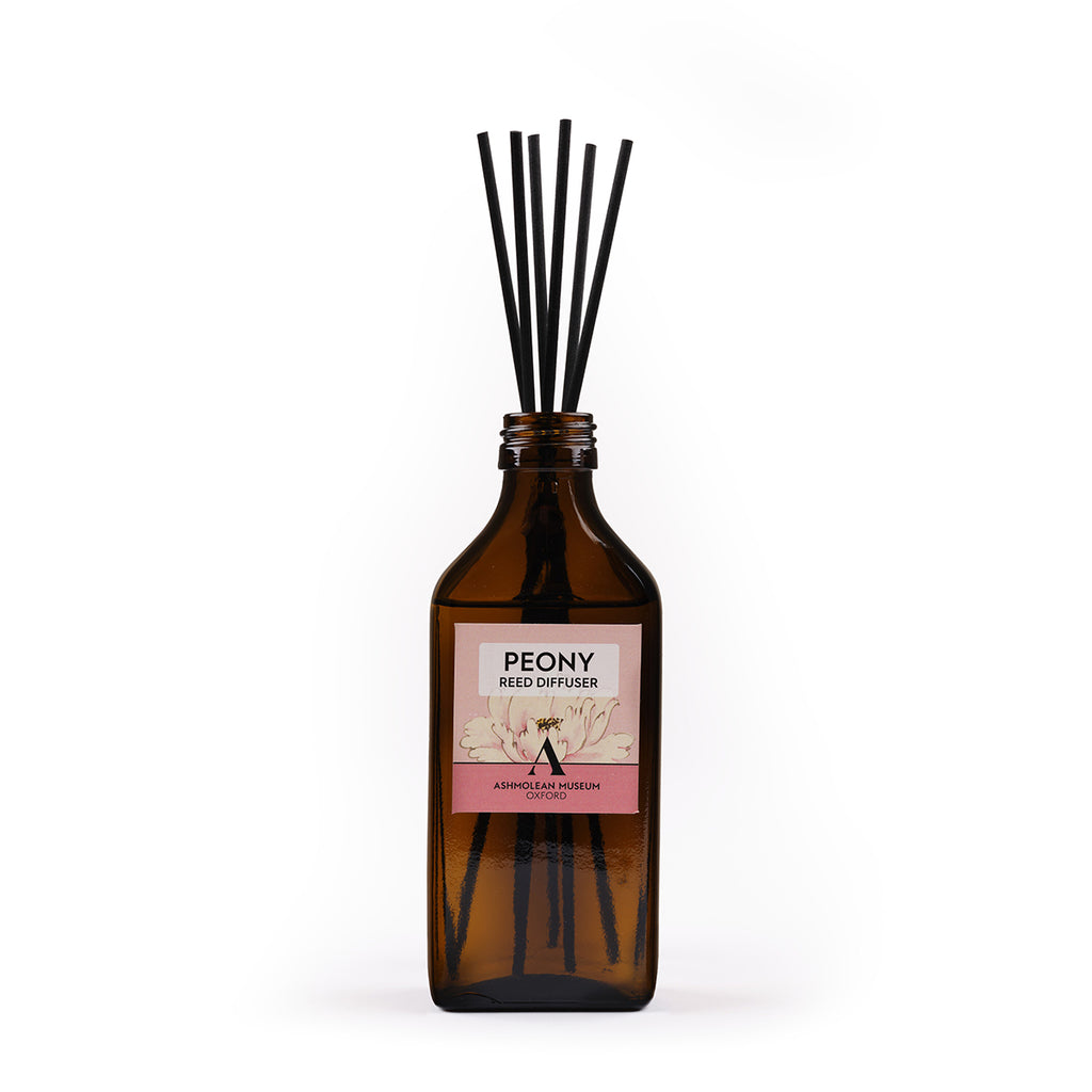 Reed diffuser with 'Peony' label on a white background