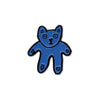 Blue bear-shaped pin badge on a white background