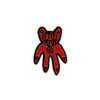 Red bear-shaped pin badge on a white background