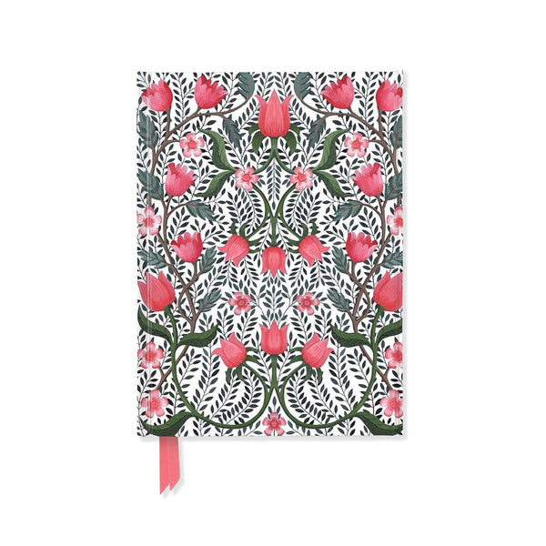 Floral patterned notebook with pink ribbon on a white background