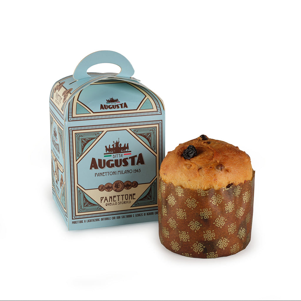 Panettone with decorative packaging on a white background