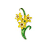 Brooch with yellow flowers and green leaves on a white background