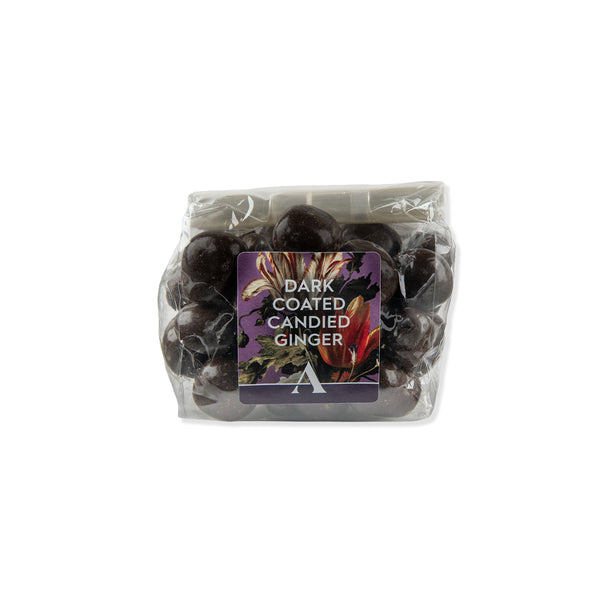 Packaged dark coated candied ginger with a label on a white background