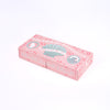 A pink decorative chocolate box with illustrated shell and swirl designs, featuring the text 'Dreams of Aphrodite' and 'Chocolate Shells & Hearts,' photographed on a clean white background.