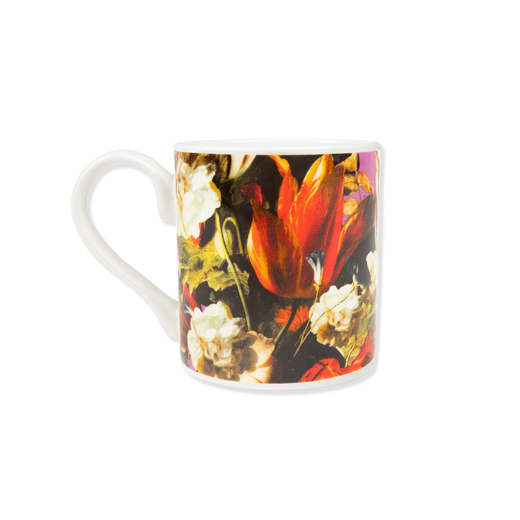 China mug with floral Dutch still life painting print on a white background.
