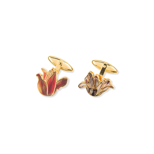 Pair of gold tone cufflinks in the shape of blooming flowers inspired by Dutch still life paintings on a white background.