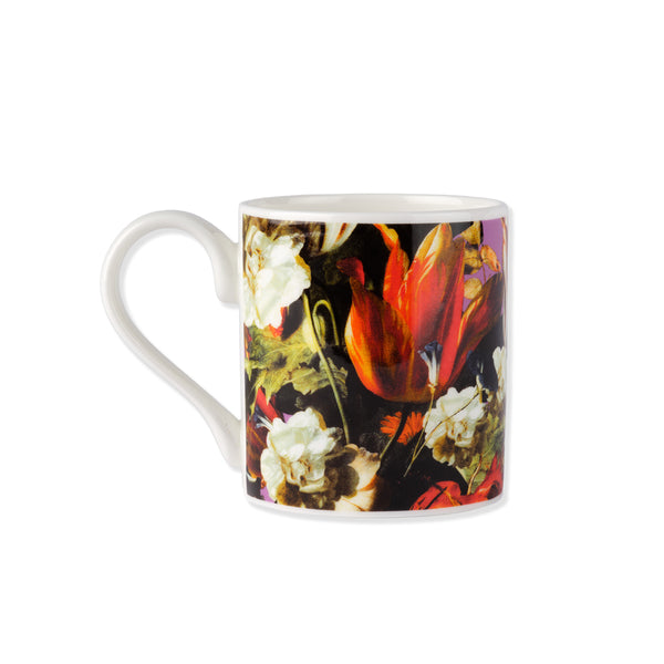 China mug with floral Dutch still life painting print on a white background.