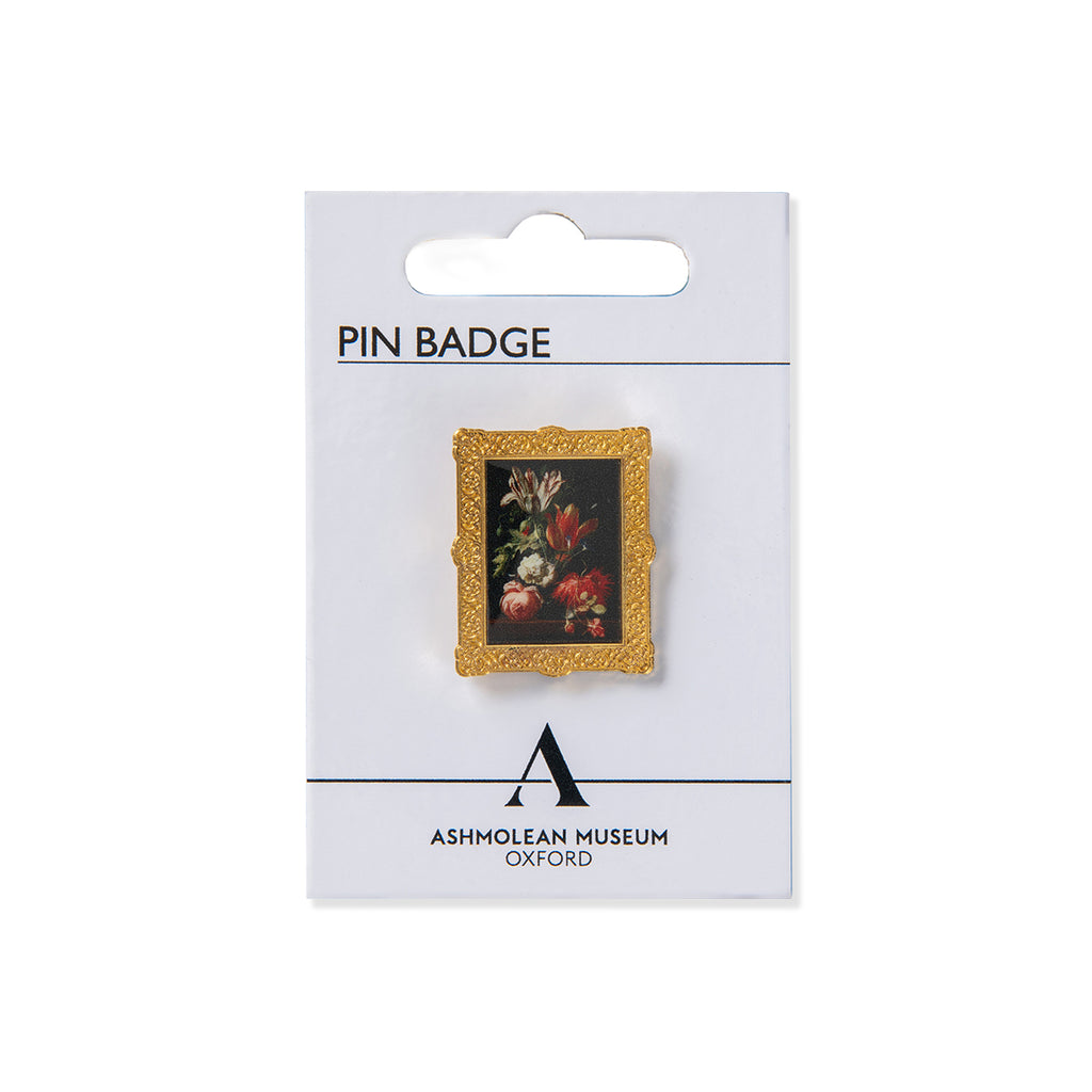 Pin Badge of Dutch still life floral painting with gold frame on Ashmolean branded white card against a white background. 