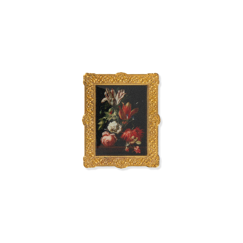 Metal pin badge of decorative gold frame with a painting of flowers on a white background