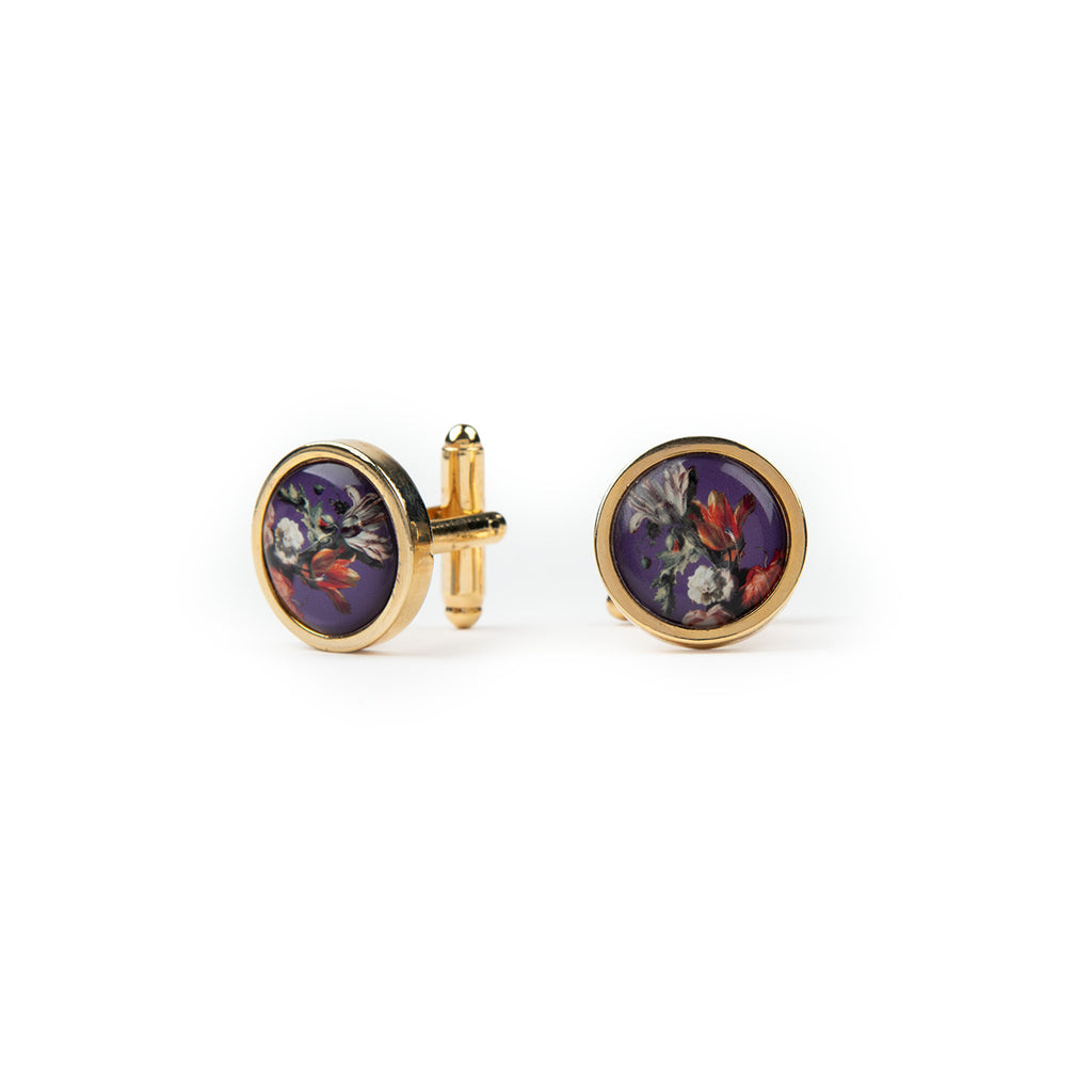 Pair of floral purple cufflinks on a white background