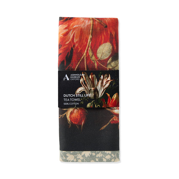 Tea towel with floral design and Ashmolean Museum of Art and History branding on a white background
