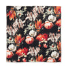 Floral patterned fabric with red, orange, and white flowers on a black background