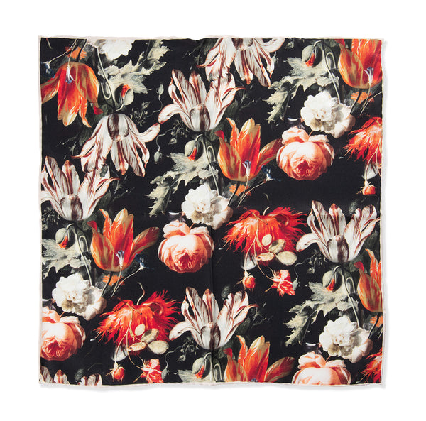 Floral patterned fabric with red, orange, and white flowers on a black background