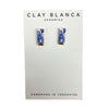 Pair of earrings on a Clay Blanca Ceramics card with floral design
