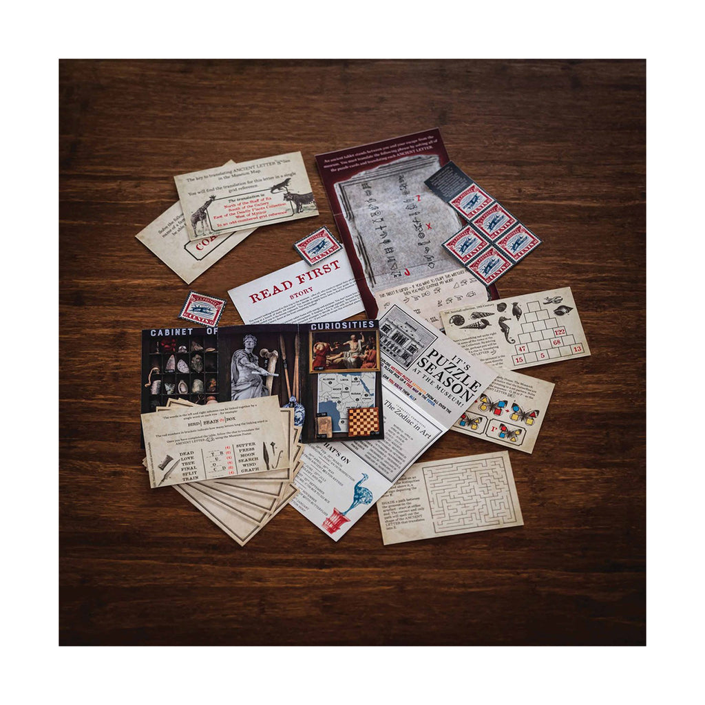 Collection of vintage cards and posters on a wooden surface