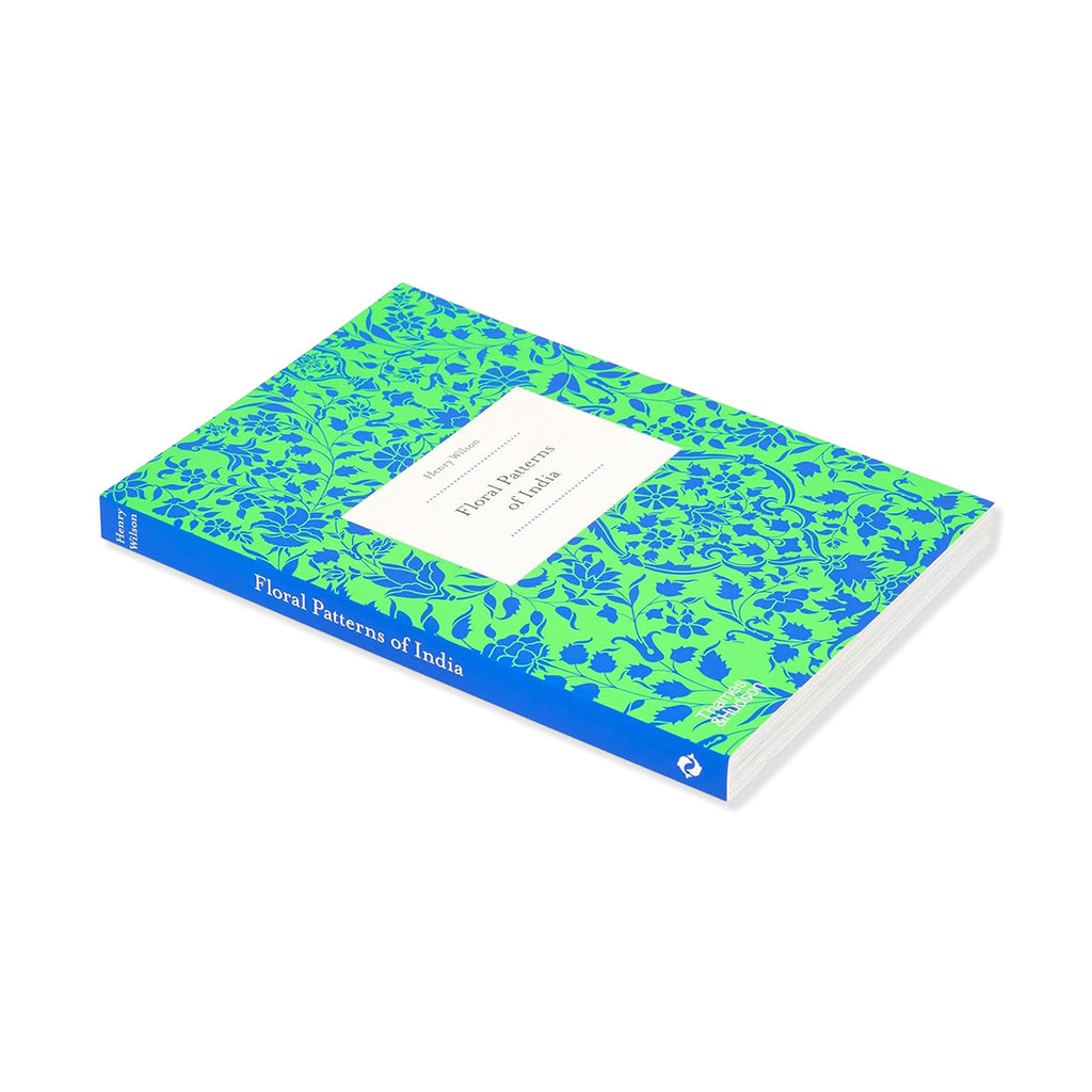 Notebook with blue and green floral pattern on a white background