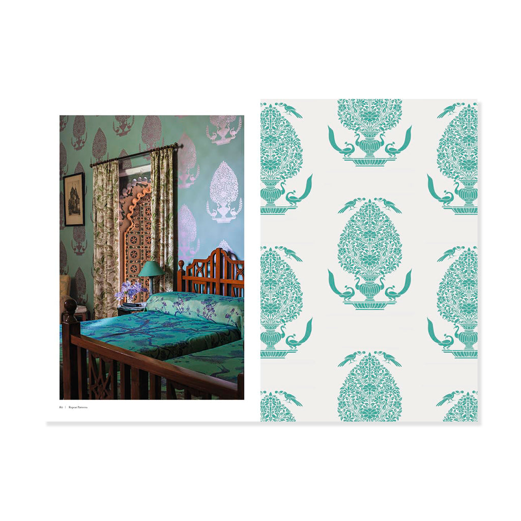 Page insert of Indian bedroom with green and white patterned wallpaper and matching bedspread.