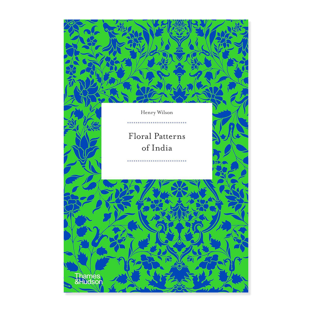 Book cover with blue floral patterns on a green background