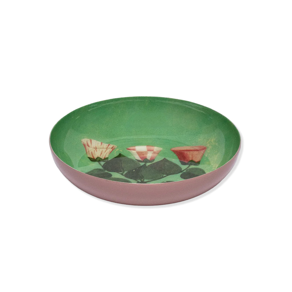 Side profile of flowers round enamel tray with green inside and pink outside of tray with pink and white flower painted design on a white background.