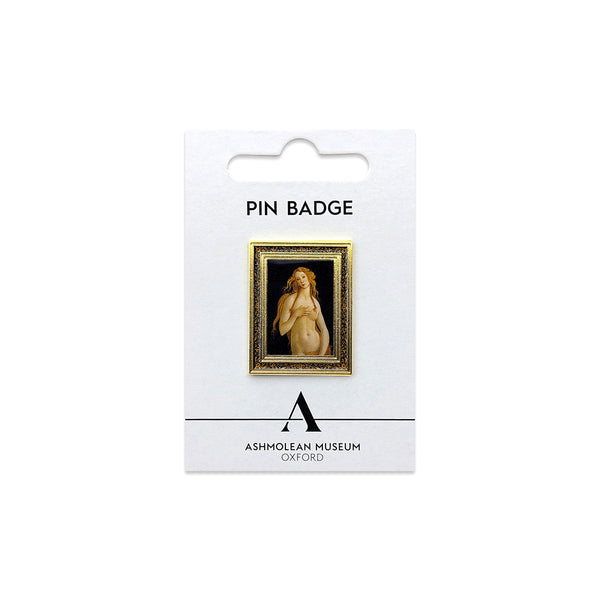 A framed art pin badge featuring a classical painting of a nude female figure, mounted on a white Ashmolean Museum Oxford display card.