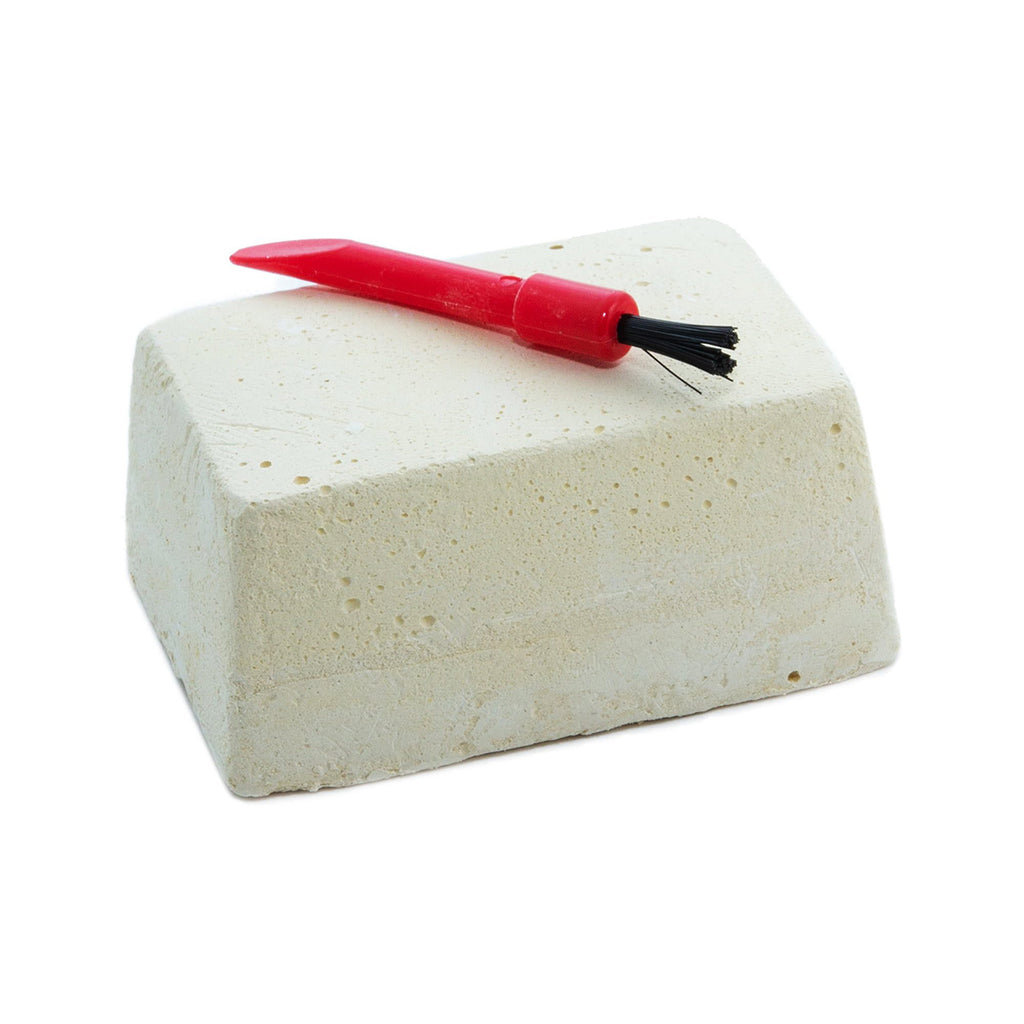 Block of excavating plaster with a red tool on a white background