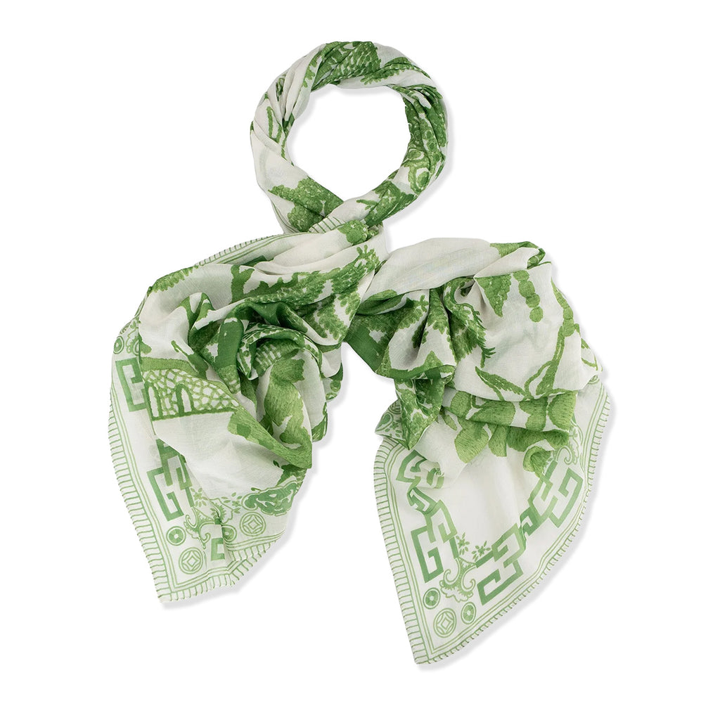 Large patterned scarf with green florals on a white background.