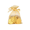 Gold chocolate coins in a drawstring bag on a white background