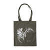 Green tote bag with a white floral design on a white background