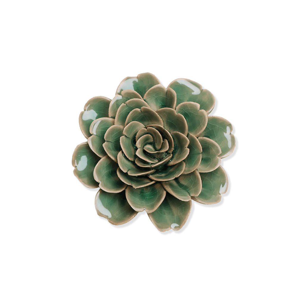 Green ceramic rose flower plant on a white background