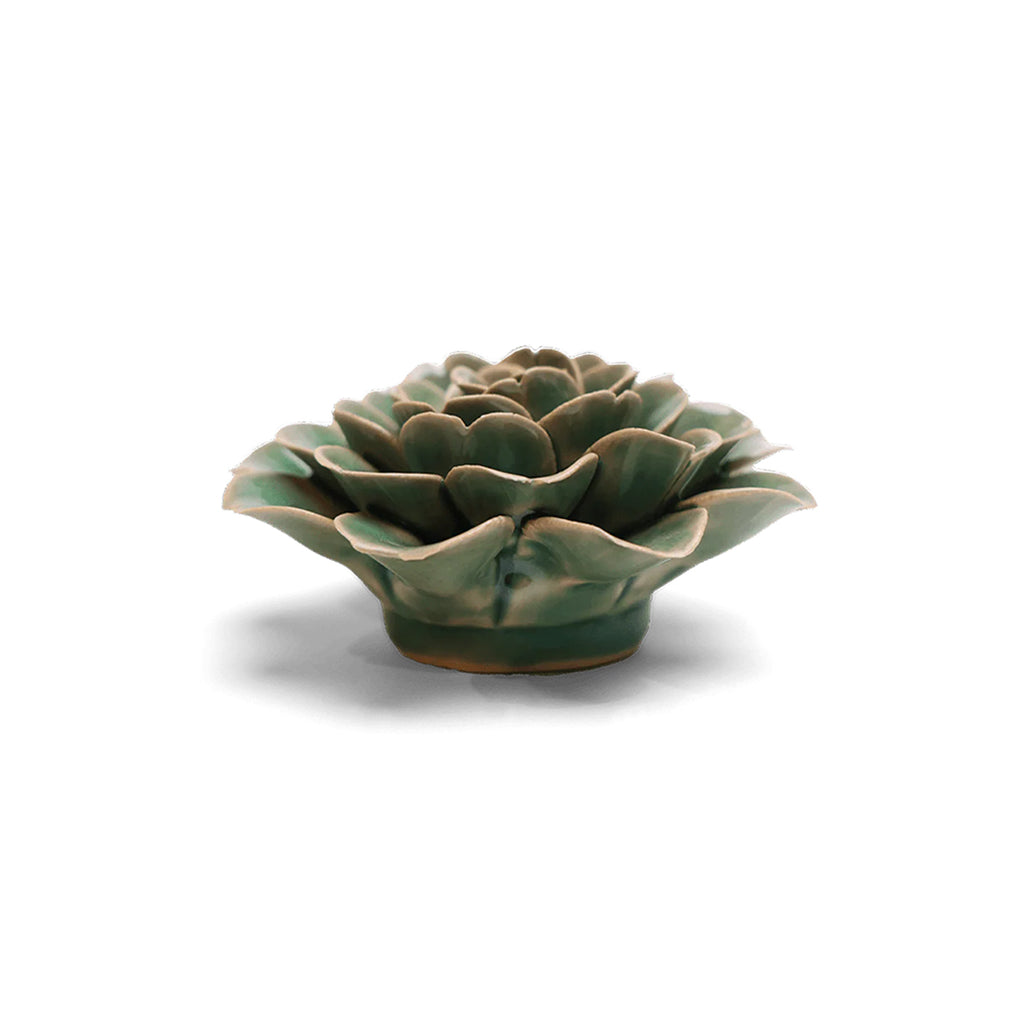 Green ceramic rose plant-shaped object on a white background