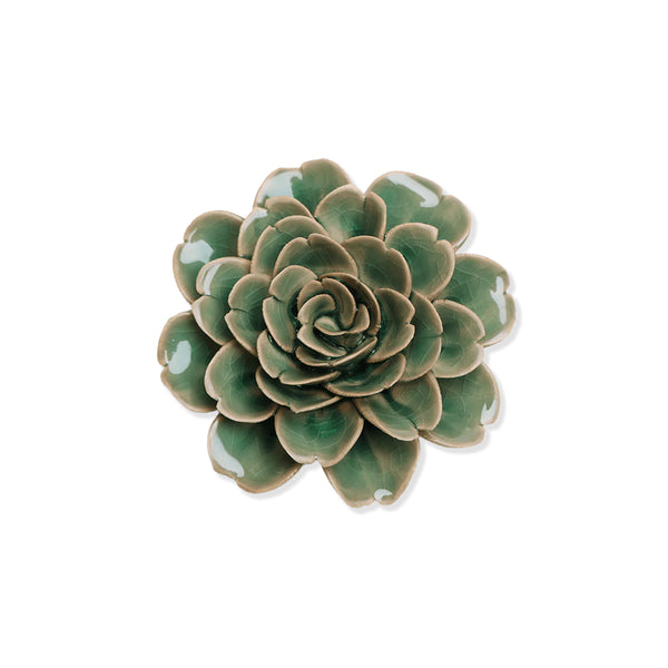 Green ceramic rose flower plant on a white background
